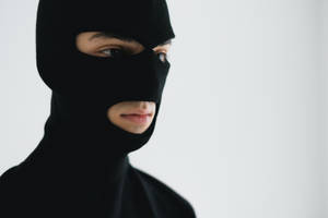 Man Wearing A Black Ski Mask Wallpaper