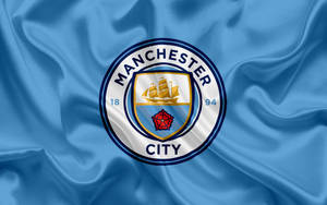 Manchester City's Official Logo And Flag Wallpaper