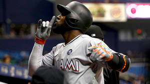 Marcell Ozuna Of The Atlanta Braves Doing A Shush Pose During A Game Wallpaper