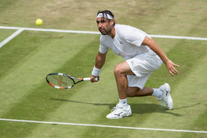 Marcos Baghdatis Looking At Ball Wallpaper