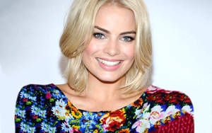 Margot Robbie In Colorful Floral Dress Wallpaper