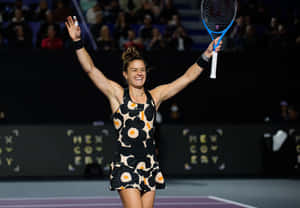 Maria Sakkari Smiling With Arms Raised Wallpaper