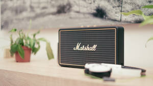 Marshall Speaker On Wooden Table Wallpaper