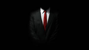 Master Assassin Agent 47 In Hitman Black Wallpaper