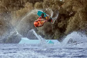 Mastering The Tootsie Roll Trick In Wakeboarding Wallpaper