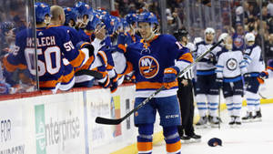 Mathew Barzal, Top Canadian Ice Hockey Player, Celebrating With His Teammates. Wallpaper