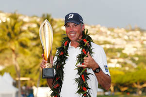 Matt Kuchar Celebrating Championship Victory With Garland And Trophy Wallpaper