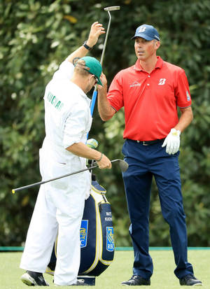 Matt Kuchar Dressed In A Red Shirt On The Golf Course Wallpaper