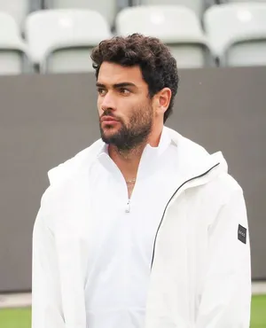 Matteo Berrettini In White Jacket Wallpaper