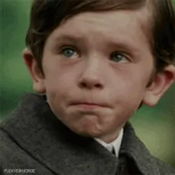 Melancholy Up Close - Emotionally Poignant Image Of A Sad Boy Wallpaper