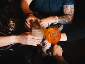 Men Clinking Glasses Of Drinks Wallpaper