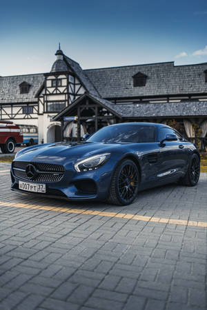 Mercedes Sls Gt Parked In Front Of A House Wallpaper