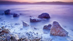 Mesmerizing Salt Formation Cloaked In Mist At The Dead Sea Wallpaper