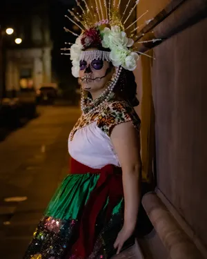 Mexican Woman With A La Calavera Face Painting Wallpaper
