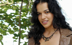 Michelle Rodriguez In Her Iconic Role Wallpaper