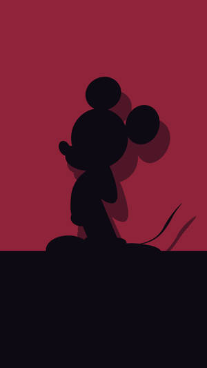 Mickey Mouse Showing His Fun-loving Spirit In Red & Black Wallpaper