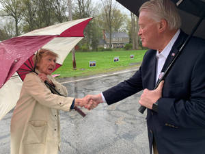 Mike Gibbons Shaking Hands With Woman Wallpaper