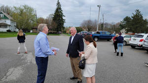 Mike Gibbons With Citizens At Parking Lot Wallpaper