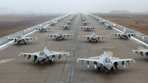 Military Jets Lined Up On Runway Wallpaper