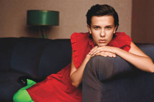 Millie Bobby Brown Looking Regal In A Red Dress Wallpaper