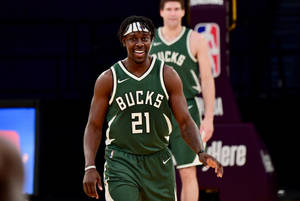 Milwaukee Mvp Star Player Jrue Holiday Wallpaper