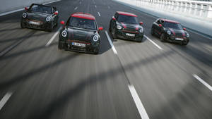 Mini Black And Red Cars On Road Wallpaper