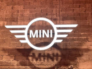 Mini Cooper Logo Projectedon Brick Wall Wallpaper