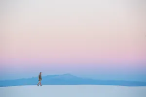 Minimalist Desktop Man Walking On Sand Wallpaper