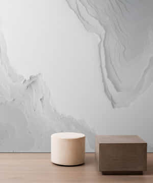 Minimalist Interiorwith Marble Walland Geometric Stools Wallpaper