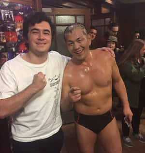 Minoru Suzuki Taking A Selfie With A Lucky Fan Wallpaper