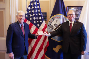 Mitch Mcconnell Receiving Covid-19 Booster Shot Wallpaper