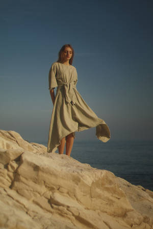 Model Gaia Vigo Pajon Shows Off A Stunning Designer Dress, Perfect For A Summer's Day. Wallpaper