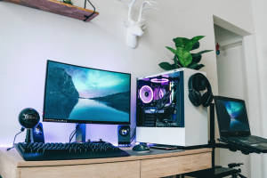 Modern Desktop Computer And Laptop On A Table Wallpaper