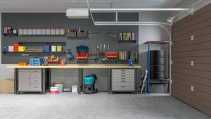 Modern Garage Equipped With Storage Room And Repair Tools Wallpaper