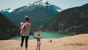 Mom Looking At The Mountains Wallpaper