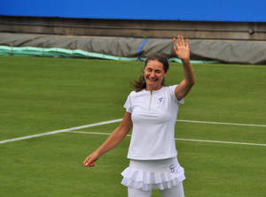 Monica Niculescu Waving To Audience Wallpaper