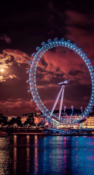 Moonlit Majesty Over London Eye Wallpaper