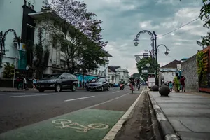 Morning City Riding A Bike Wallpaper