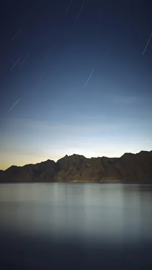 Mountains By The Sea Ios Default Wallpaper
