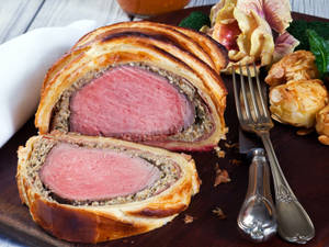 Mouthwatering Beef Wellington On A Presentable Plate Wallpaper