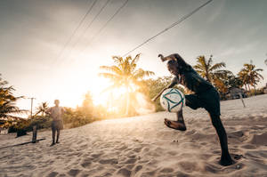 Mozambique Man Playing Football Wallpaper