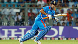 Ms Dhoni Running In Field Wallpaper