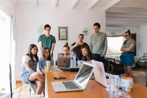 Multidisciplinary Team Collaborating At Workspace Wallpaper