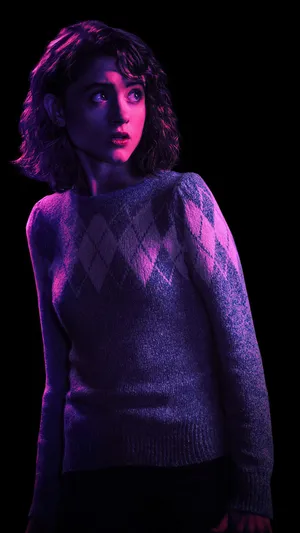 Natalia Dyer In A Dark Scene Wallpaper