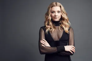 Natalie Dormer Smiling Radiantly In A Blue Dress Wallpaper