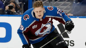 Nathan Mackinnon Of Colorado Avalanche In Action Wallpaper