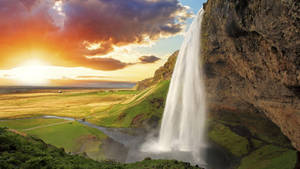 Nature's Majestic Beauty At Seljalandsfoss Waterfall Wallpaper