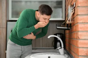 Nauseous Man In Green Sweater Wallpaper