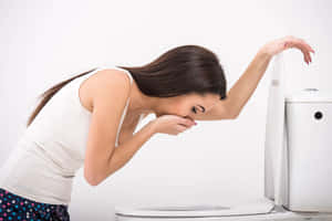 Nauseous Woman At The Toilet Wallpaper