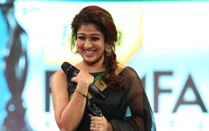 Nayanthara Holding Microphone Wallpaper